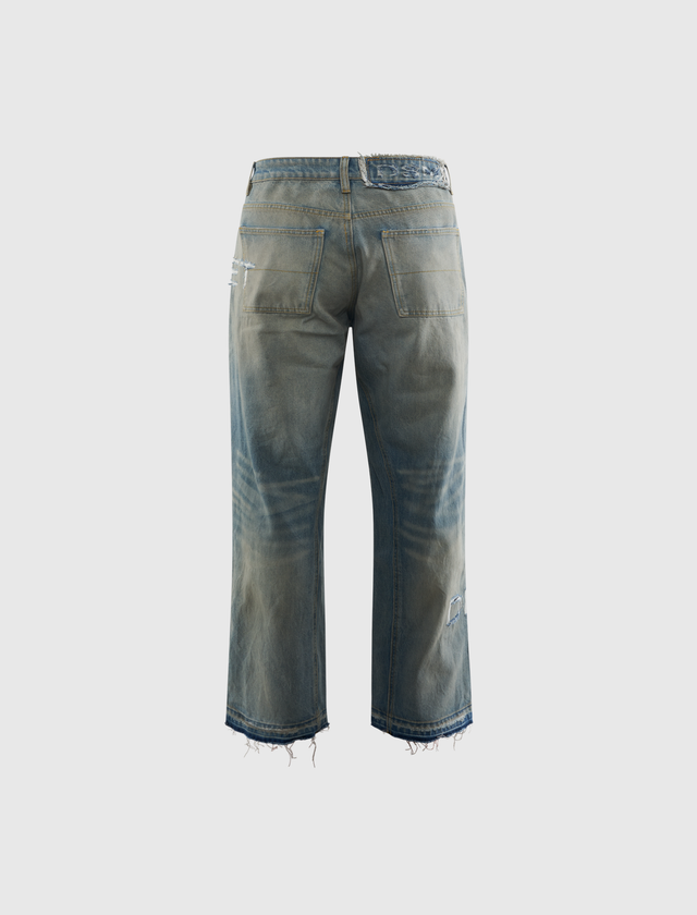 DISTRESSED STENCIL DENIM JEANS
